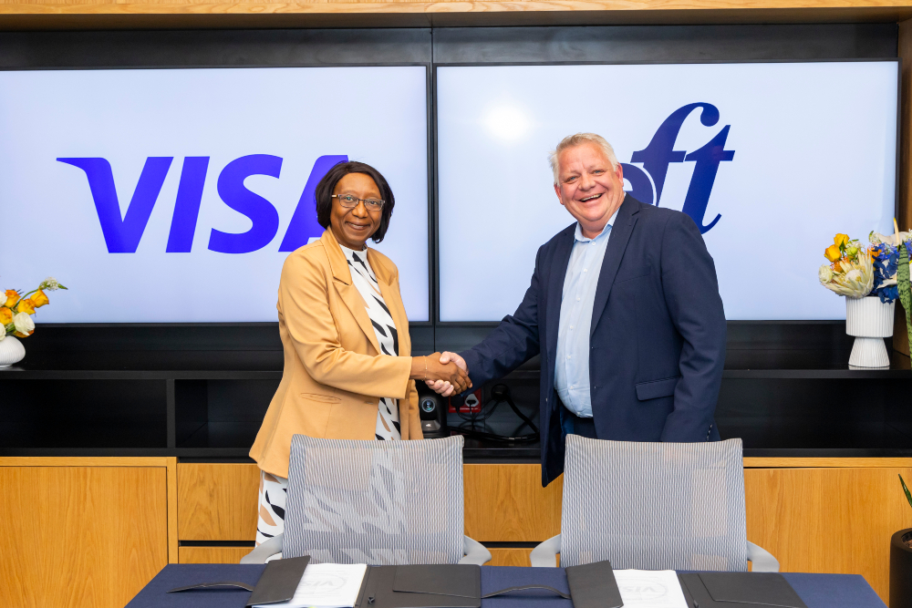 Aida Diarra, Senior Vice President and Head of Sub-Saharan Africa at Visa with Clayton Hayward, Group CEO of EFTCorp at a signing ceremony on 21 October 2024